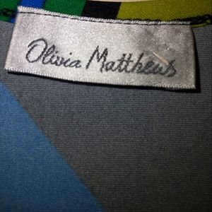 Olivia Matthews 2X black dress with blue, green, yellow and white detail lines